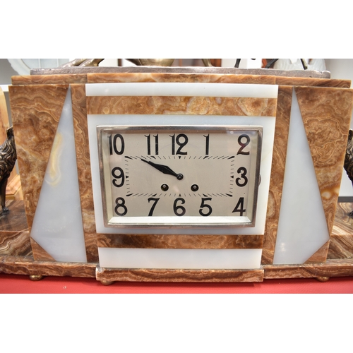 1031 - An Art Deco mantel clock bearing signatures to hounds FH DANVIN, movement by Samuel Martin visible c... 