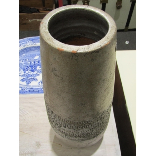 1039 - A large terracotta vase in silver/grey, 42cm tall