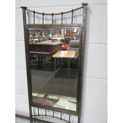 1038 - An Arts & Crafts style metal dressing table with mirror-back over a glass top and seagrass under- ti... 