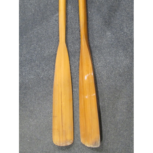 1053A - A pair of wooden oars, 182cm long approximately