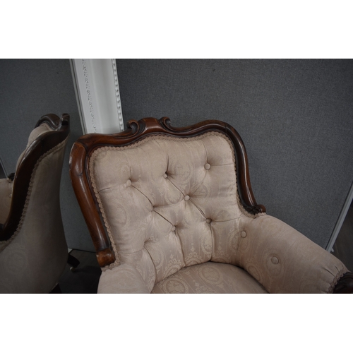 1022 - An early-mid 19th century rosewood ladies button back armchair, the shaped scroll back leading to ac... 