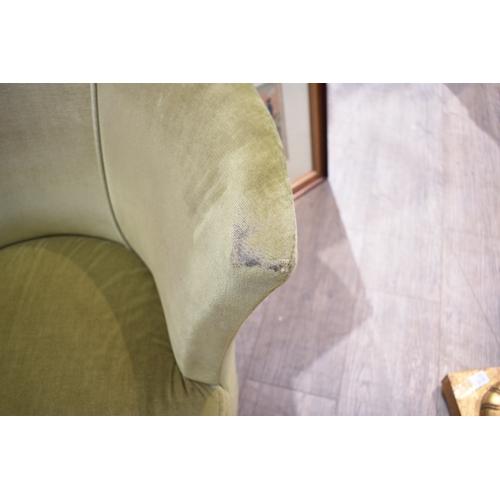 1023 - An Art Deco tub chair in green velour upholstery, 65cm tall x 80cm wide