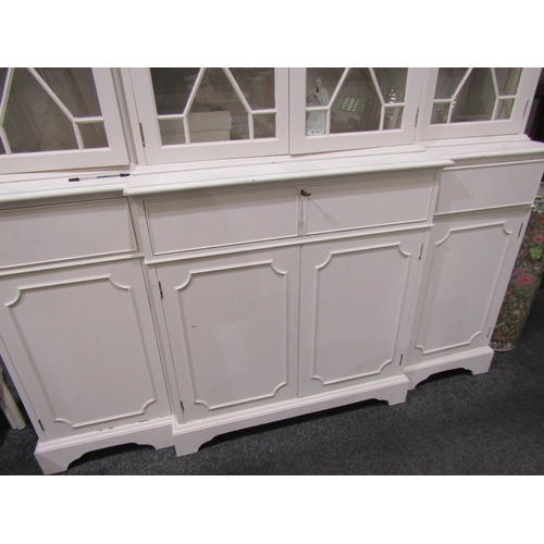 1045 - A white painted astragal glazed breakfront dresser with shelved interior on bracket feet, 203cm tall... 