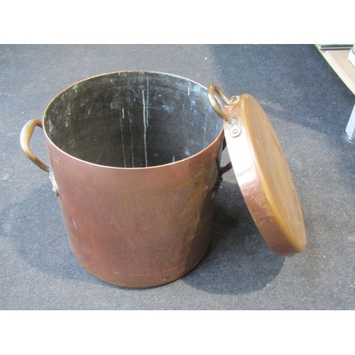 1003 - A large copper cooking pot with lid, star stamp to base, no.12 stamp to handles, 31cm diameter x 32c... 