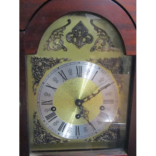 1006 - A 20th Century grand-daughter clock, with pendulum, key and weights