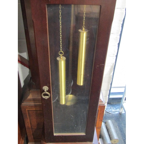 1006 - A 20th Century grand-daughter clock, with pendulum, key and weights