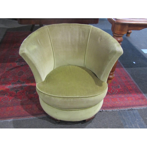 1023 - An Art Deco tub chair in green velour upholstery, 65cm tall x 80cm wide