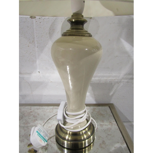 1030 - A cream based table lamp with shade