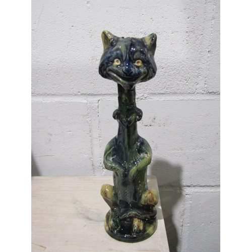 1034 - A pair of pottery cat candlesticks, necks a/f