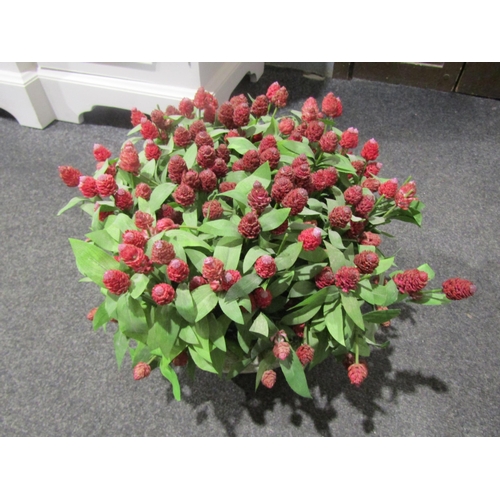 1042 - A terracotta style planter with faux plant, 30cm diameter, believed Oka brand