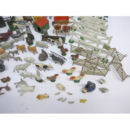 6053 - A collection of playworn Britains and similar lead farm animal figures and accessories, Dinky diecas... 