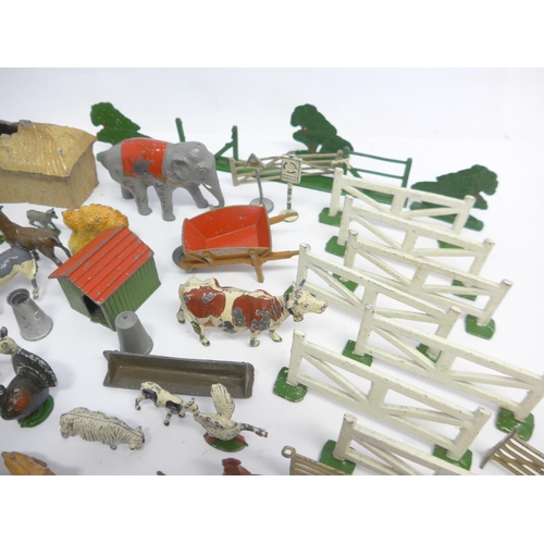 6053 - A collection of playworn Britains and similar lead farm animal figures and accessories, Dinky diecas... 