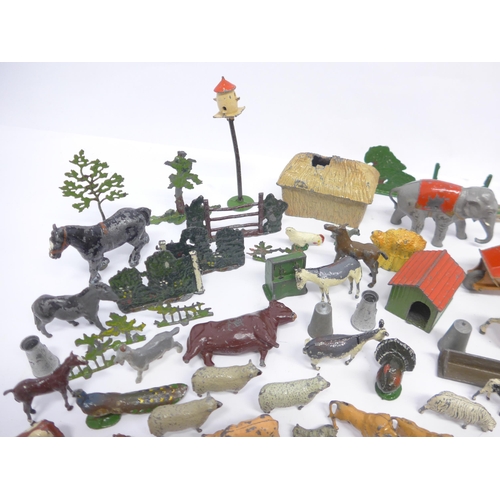 6053 - A collection of playworn Britains and similar lead farm animal figures and accessories, Dinky diecas... 