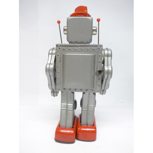 6030 - A boxed 1960s SH / Horikawa (Japan) battery operated Gear Robot with silver tinplate body, clear pla... 