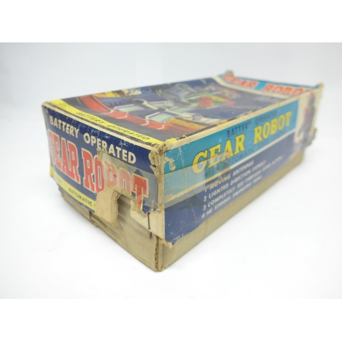 6030 - A boxed 1960s SH / Horikawa (Japan) battery operated Gear Robot with silver tinplate body, clear pla... 