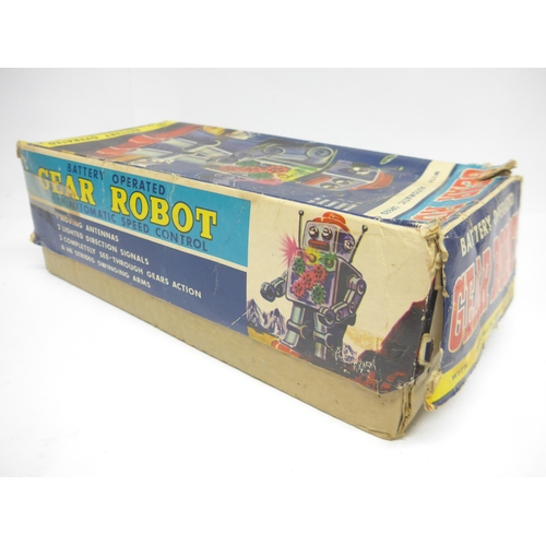 6030 - A boxed 1960s SH / Horikawa (Japan) battery operated Gear Robot with silver tinplate body, clear pla... 