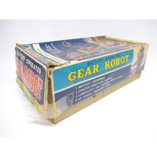 6030 - A boxed 1960s SH / Horikawa (Japan) battery operated Gear Robot with silver tinplate body, clear pla... 