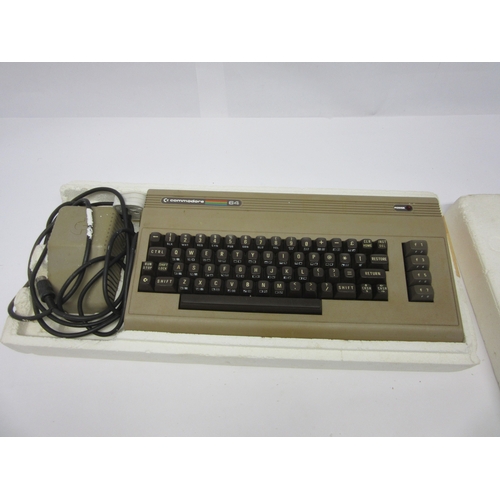 6012 - Retro Gaming - A Commodore 64 Micro Computer with assorted games including 