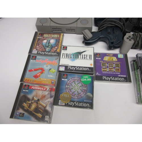 6013 - Retro Gaming - A Sony Playstation 1 video games console with assorted Playstation 1, 2 & PSP games i... 