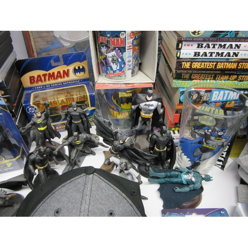 6019 - A collection of Batman memorabilia to include figures, clothing, DVDs and videos, Corgi Batmobile, e... 