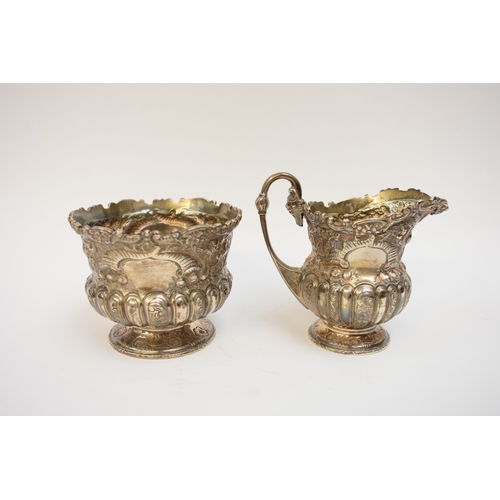 5005 - A Victorian Wakely & Wheeler silver bachelor's three piece tea set with embossed floral, leaf and sc... 