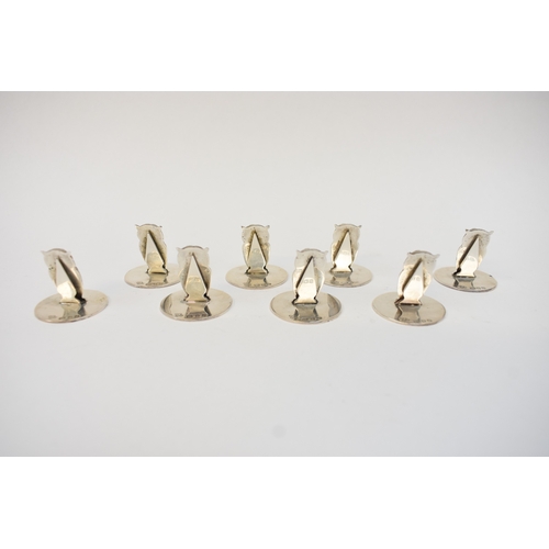5029 - A set of eight Asprey of London silver owl menu/place setting holders, London 1969, 3.2cm tall, in A... 