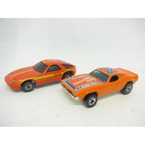 6021 - A Mattel Hot Wheels Super Rally Case containing six Hot Wheels diecast cars to include Porsche 928 T... 