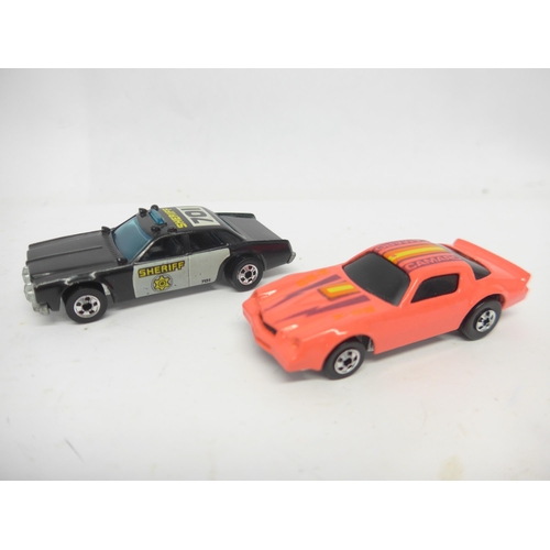 6021 - A Mattel Hot Wheels Super Rally Case containing six Hot Wheels diecast cars to include Porsche 928 T... 