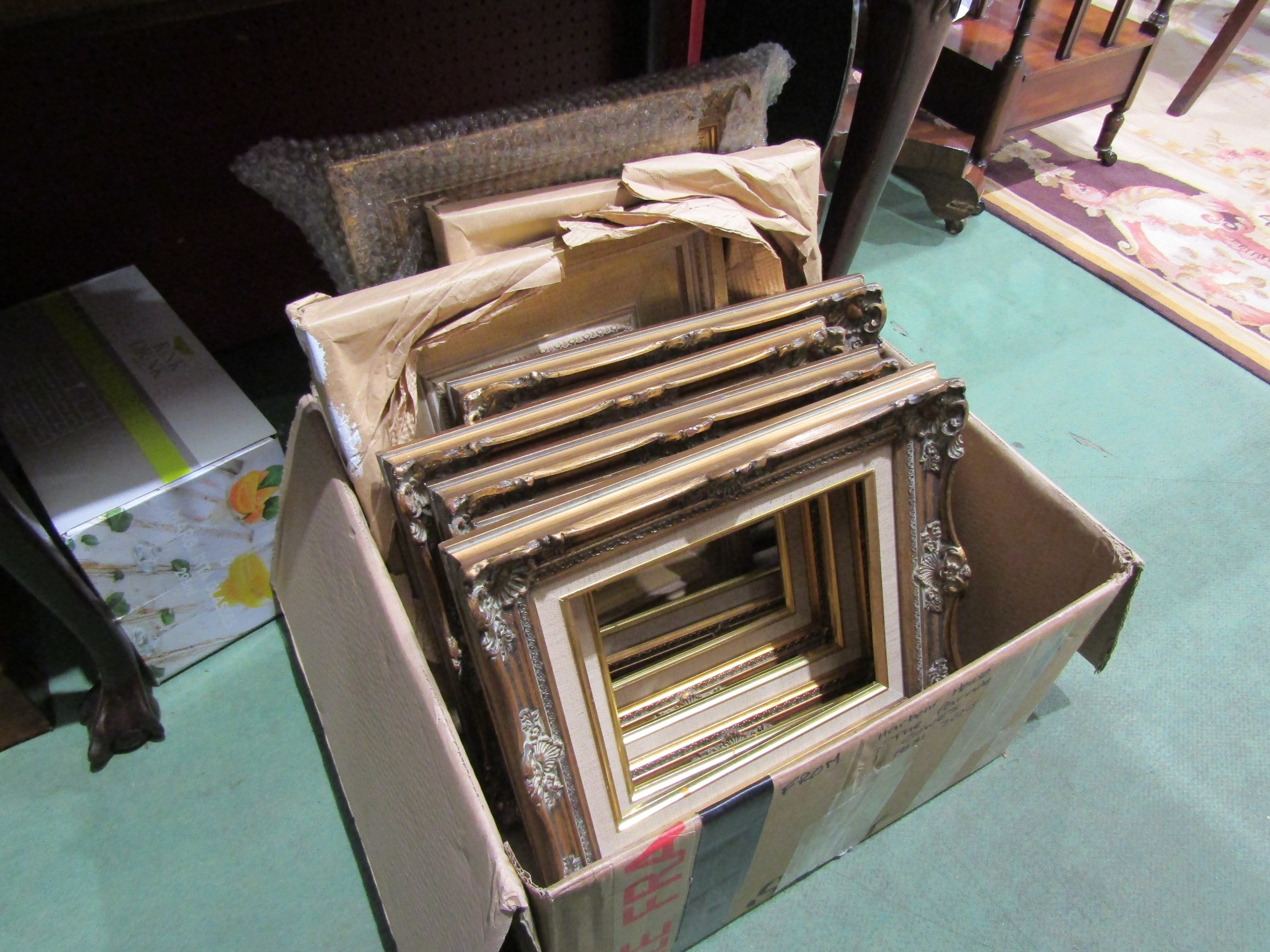 Eight small gilt picture frames of various styles and sizes