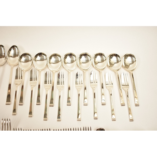 5106 - A Cooper Brothers & Sons Ltd silver eight place canteen of cutlery comprising four serving spoons, e... 