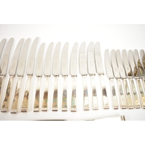 5106 - A Cooper Brothers & Sons Ltd silver eight place canteen of cutlery comprising four serving spoons, e... 