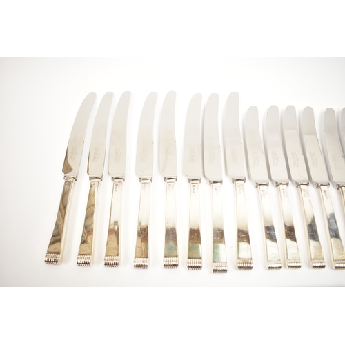 5106 - A Cooper Brothers & Sons Ltd silver eight place canteen of cutlery comprising four serving spoons, e... 