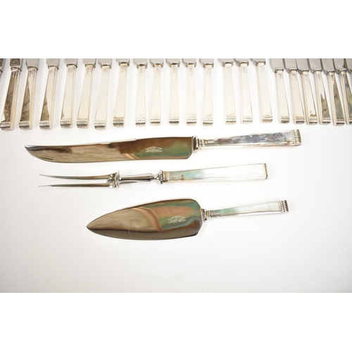 5106 - A Cooper Brothers & Sons Ltd silver eight place canteen of cutlery comprising four serving spoons, e... 