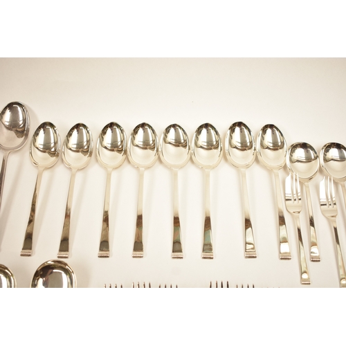 5106 - A Cooper Brothers & Sons Ltd silver eight place canteen of cutlery comprising four serving spoons, e... 