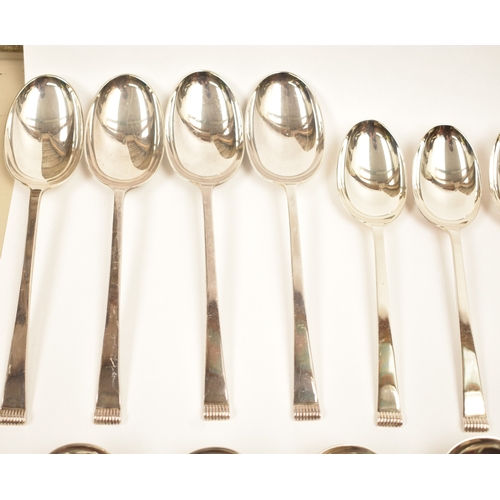5106 - A Cooper Brothers & Sons Ltd silver eight place canteen of cutlery comprising four serving spoons, e... 
