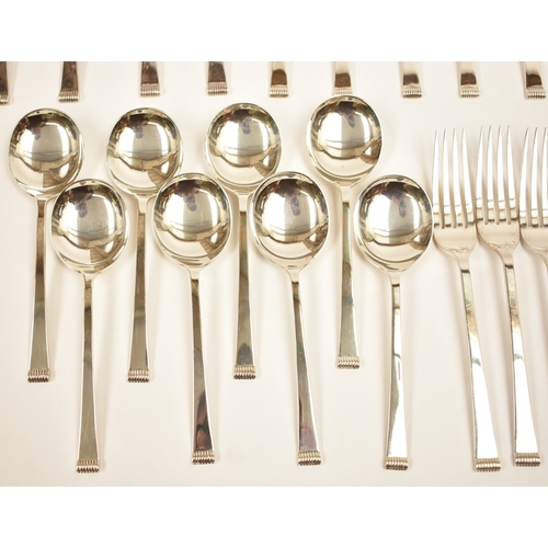 5106 - A Cooper Brothers & Sons Ltd silver eight place canteen of cutlery comprising four serving spoons, e... 
