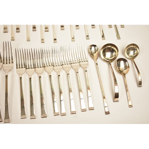 5106 - A Cooper Brothers & Sons Ltd silver eight place canteen of cutlery comprising four serving spoons, e... 