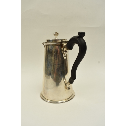 5015 - A Harrod Ltd silver coffee pot of plain form with knop finial and treen handle, London 1969, base in... 