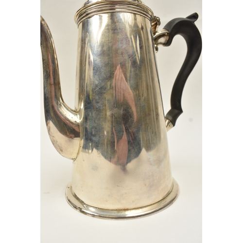 5015 - A Harrod Ltd silver coffee pot of plain form with knop finial and treen handle, London 1969, base in... 
