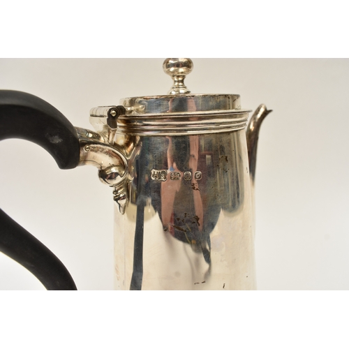 5015 - A Harrod Ltd silver coffee pot of plain form with knop finial and treen handle, London 1969, base in... 