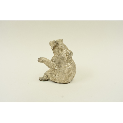 5037 - A hollow cast silver seated bear with its arms outstretched, London 1967, maker SMD, weighted base, ... 