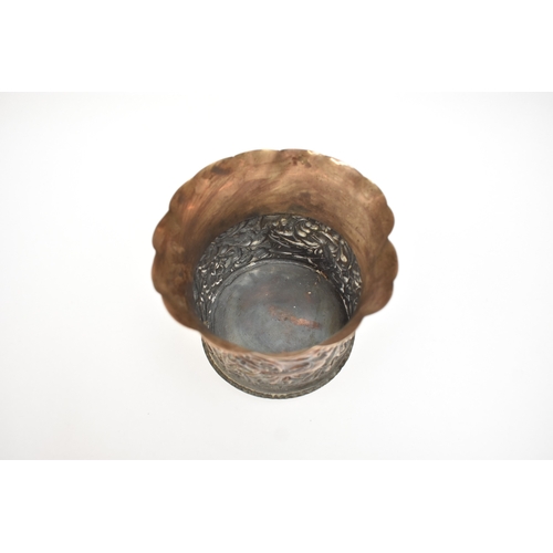 5052 - A William Comyns & Sons silver pot with frilled edge, slightly dented, the body embossed with birds ... 