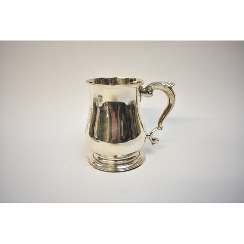5072 - A Thos. Whipham & Wilm. Williams 18th Century George II silver pint mug of baluster form, with monog... 