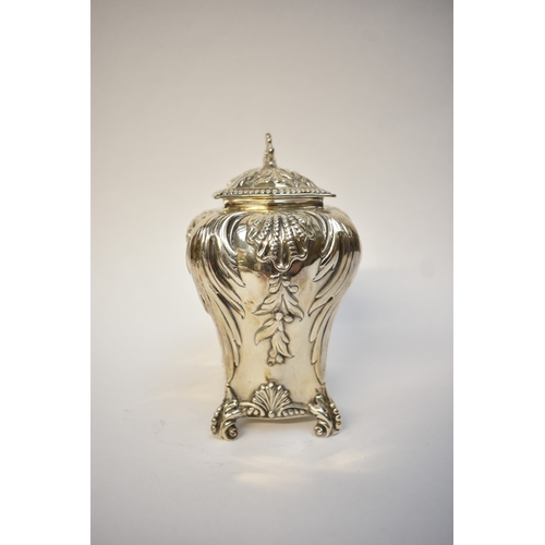 5080 - A George Fox Victorian silver tea canister, repoussé decoration of foliate swags over four scrolled ... 