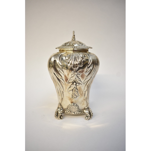 5080 - A George Fox Victorian silver tea canister, repoussé decoration of foliate swags over four scrolled ... 