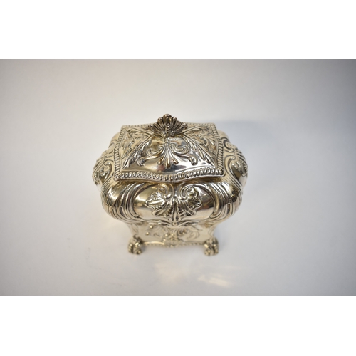 5080 - A George Fox Victorian silver tea canister, repoussé decoration of foliate swags over four scrolled ... 
