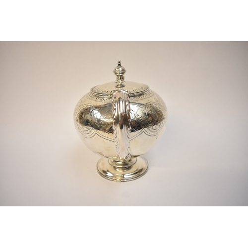 5075 - J.W. & Co., a Victorian silver teapot of pedestal form, ivory heat insulators, foliate repoussé to h... 