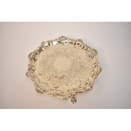 5070 - John Cafe, a Georgian silver waiter etched floral design over three stepped feet, London 1771, diame... 