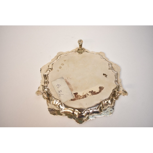 5070 - John Cafe, a Georgian silver waiter etched floral design over three stepped feet, London 1771, diame... 