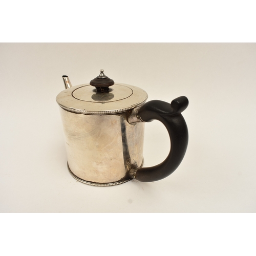 5013 - A James Young, George III silver drum shaped teapot with ebony handle and knob and engraved crest, L... 